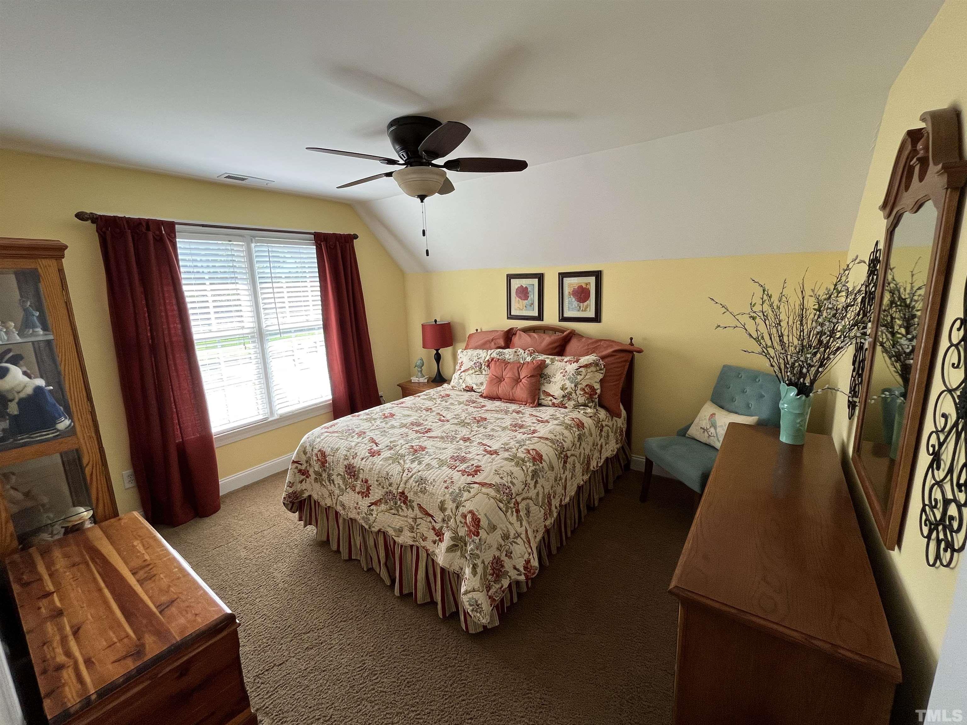 204 Challenge Road Raleigh, NC 27603 - Photo 28 of 42 a bedroom with a bed and a window