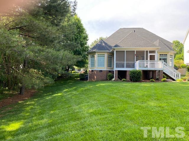 204 Challenge Road Raleigh, NC 27603 - Photo 3 of 42 a front view of a house with a garden and trees
