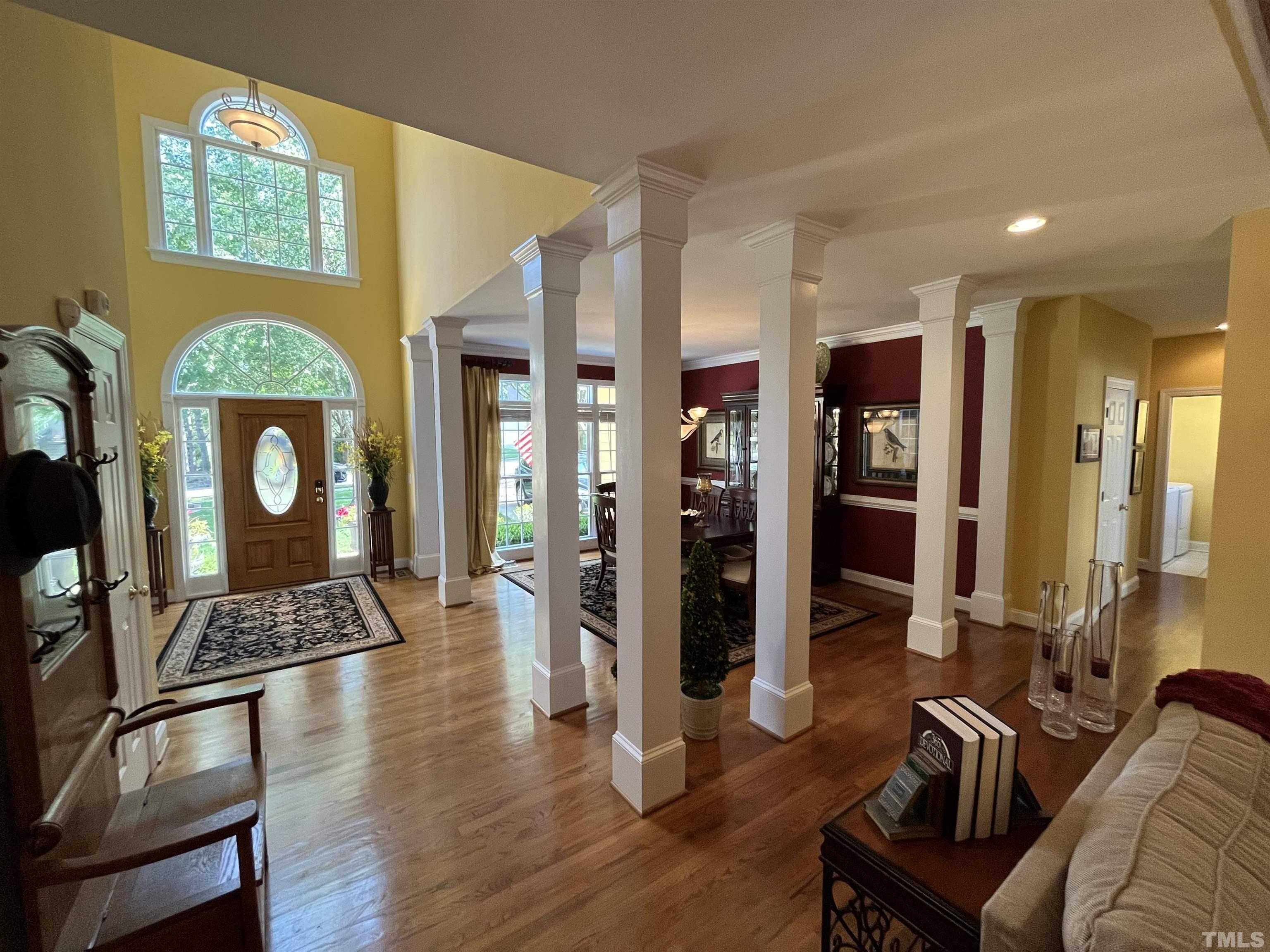 204 Challenge Road Raleigh, NC 27603 - Photo 5 of 42 a living room with furniture and a wooden floor