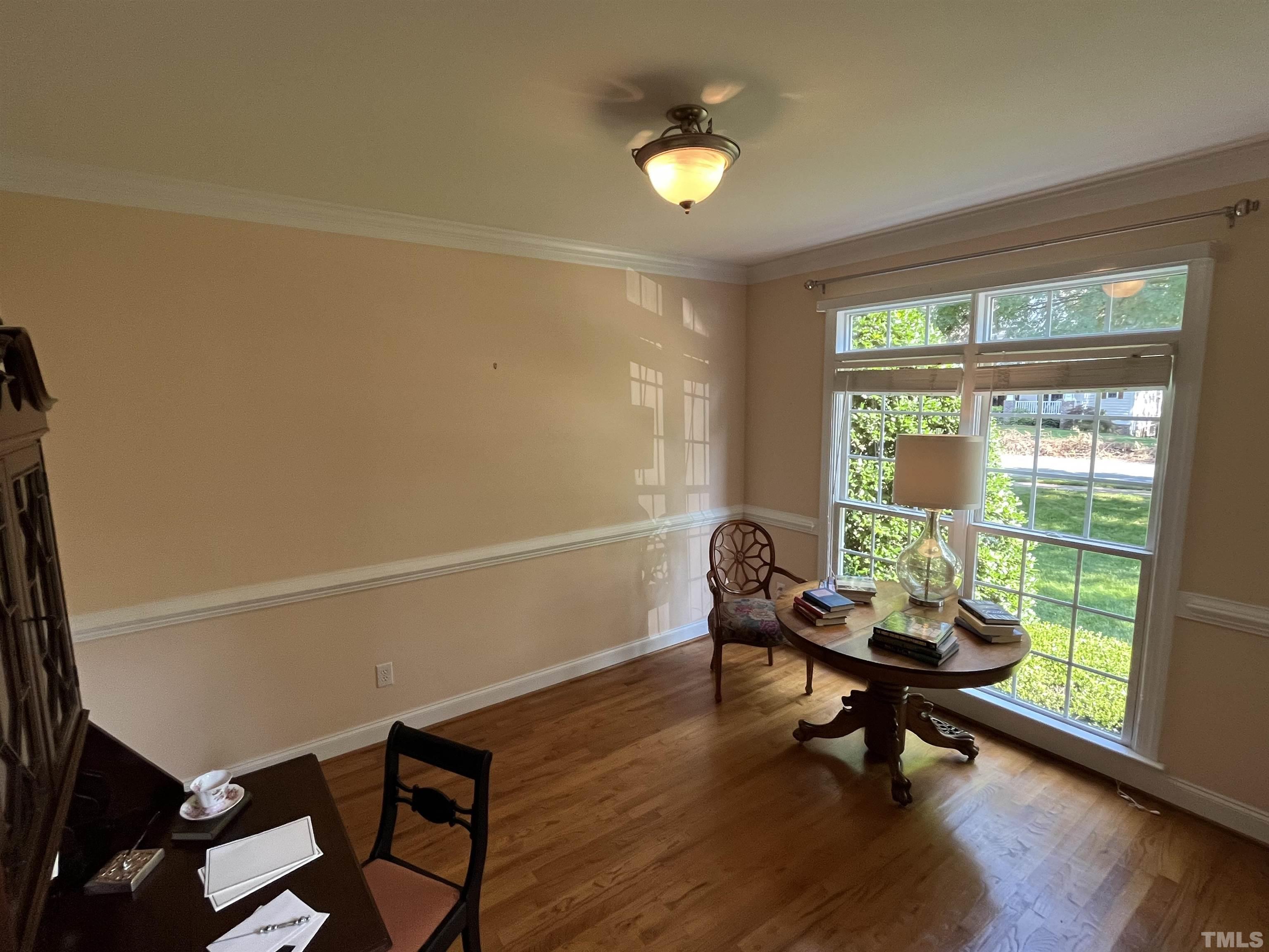 204 Challenge Road Raleigh, NC 27603 - Photo 7 of 42 a living room with furniture and a window