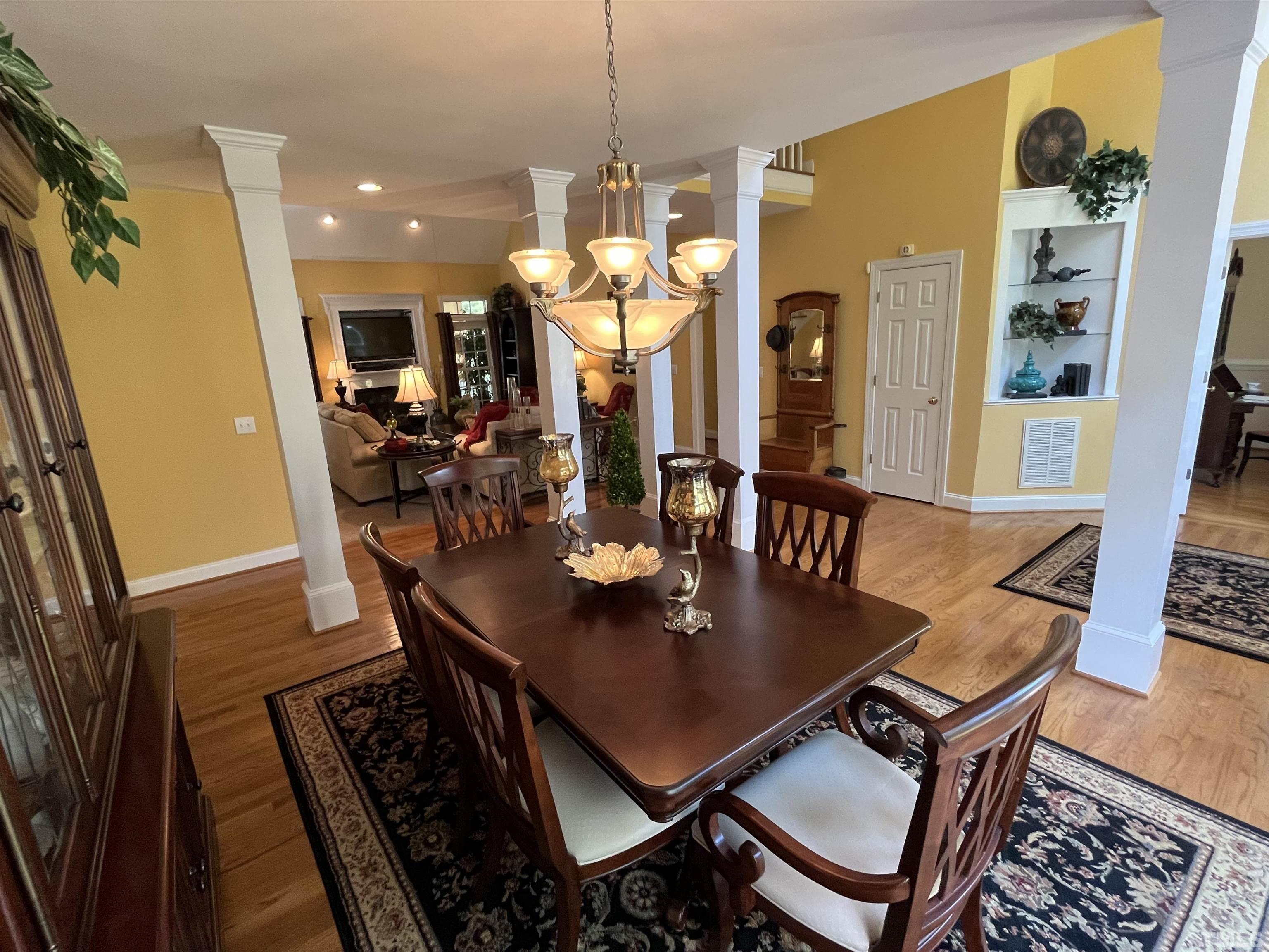 204 Challenge Road Raleigh, NC 27603 - Photo 9 of 42 a view of a dining room with furniture and wooden floor