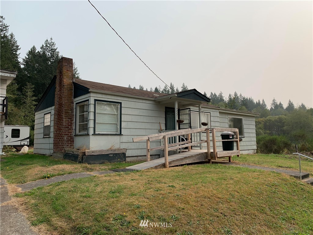 5231 Center Road Chimacum, WA 98325 - Photo 1 of 1 a view of a house with backyard