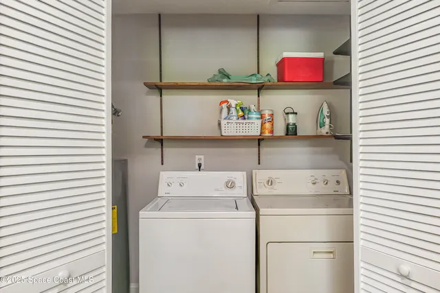a utility room with storage and utility