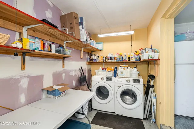 a white bench sitting in the middle of a yard
