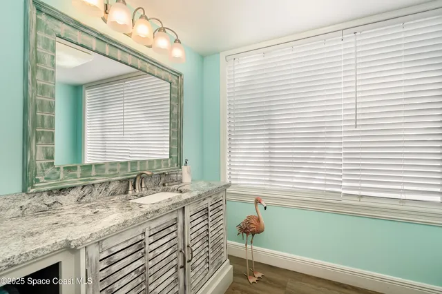 a view of a trees with yard in front of it