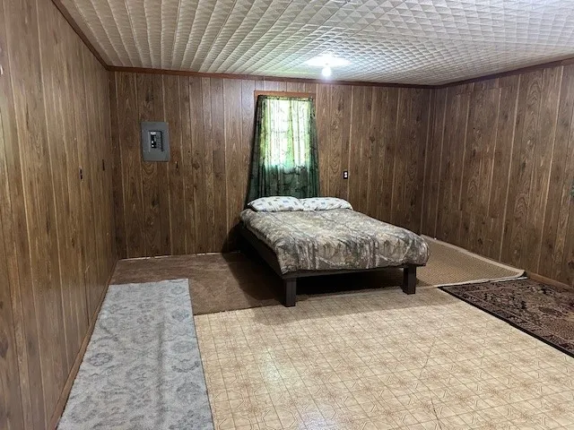 a view of a roof deck with wooden floor and outdoor seating