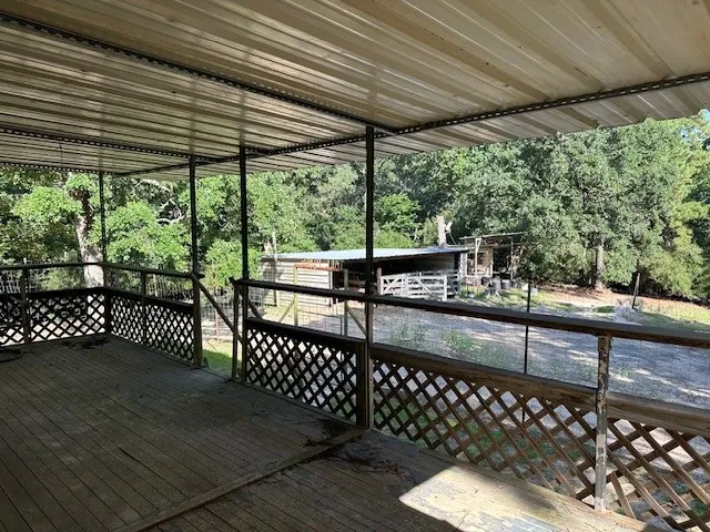 a view of a balcony with wooden floor
