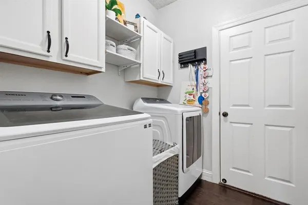 a utility room with dryer and washer