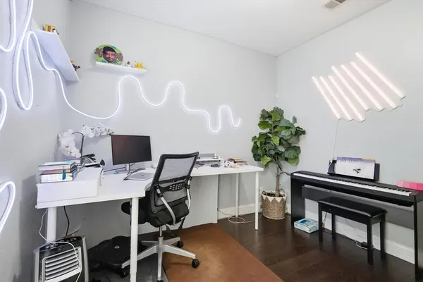 a view of a workspace with furniture
