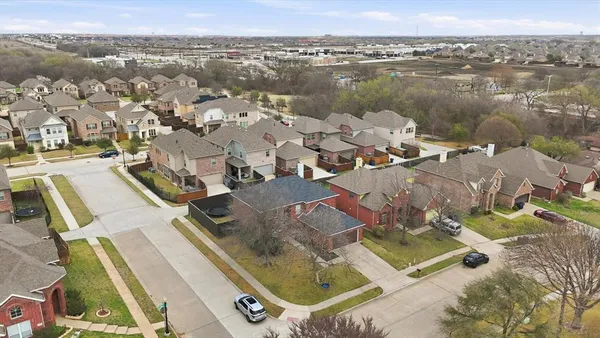 an aerial view of a house with a lake view