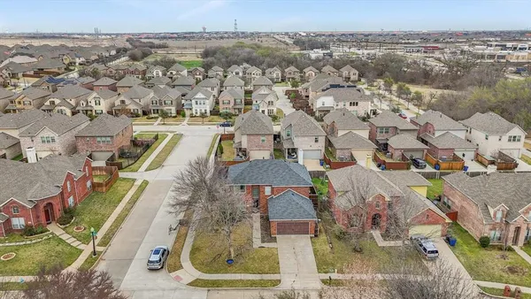 an aerial view of a house with a swimming pool