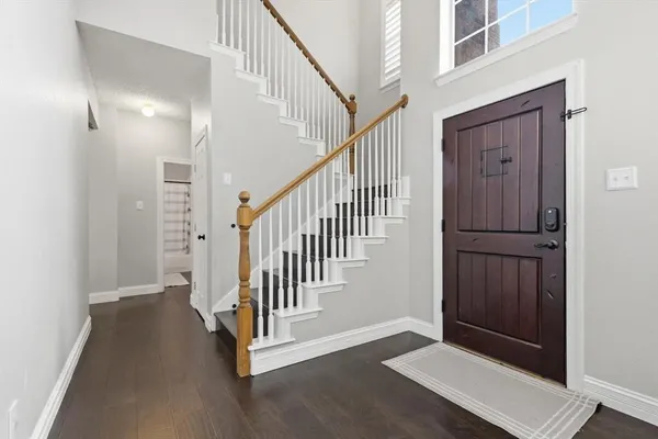 a view of a hallway with staircase