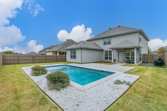 a front view of a house with swimming pool