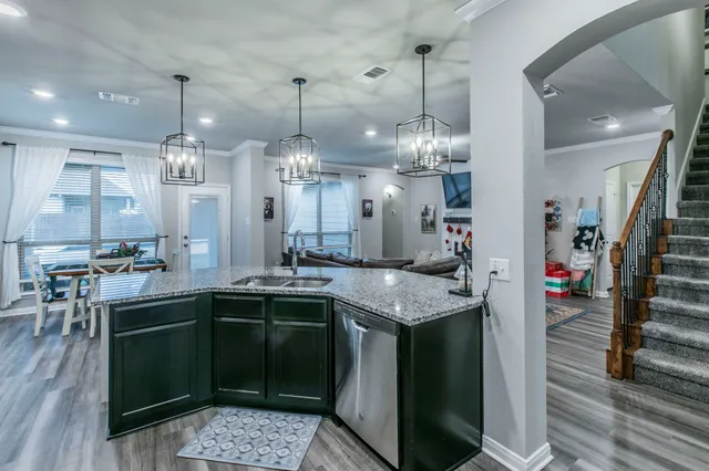 a kitchen with lots of counter space cabinets and appliances