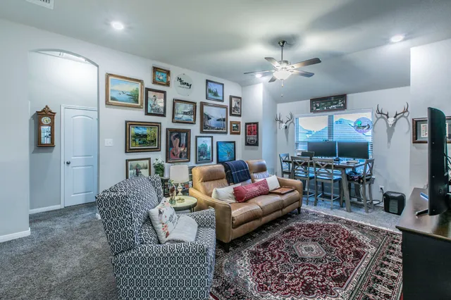 a living room with furniture and a rug