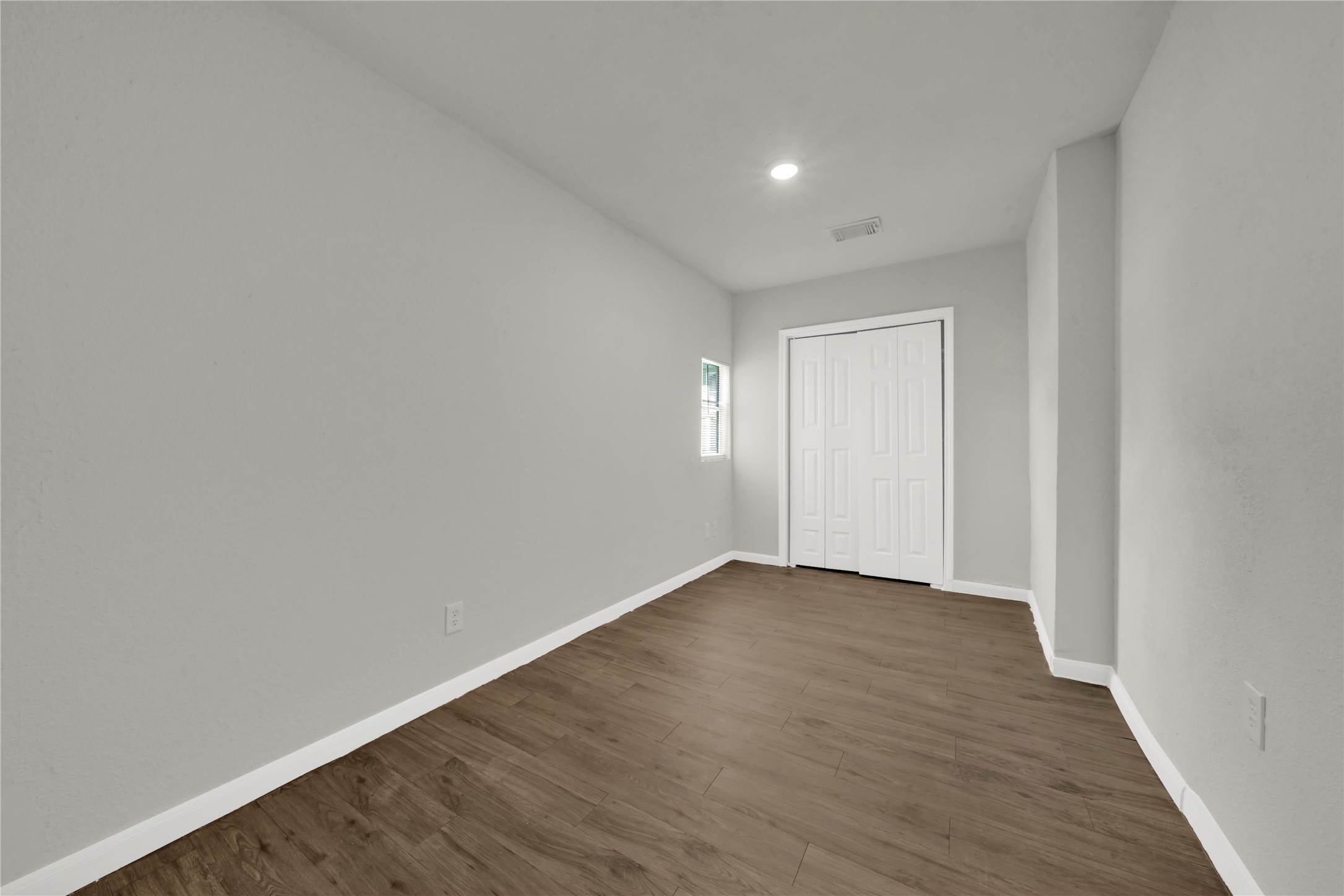 106 Hanover Street Houston, TX 77012 - Photo 14 of 49 a view of an empty room with wooden floor