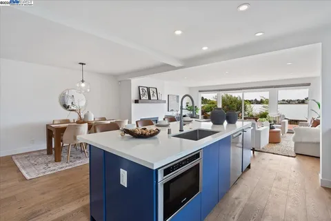 a kitchen with sink and stove