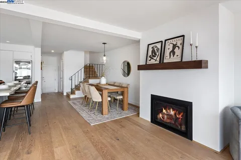 a living room with furniture a fireplace and a table