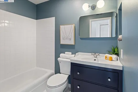 a bathroom with a sink toilet and tub