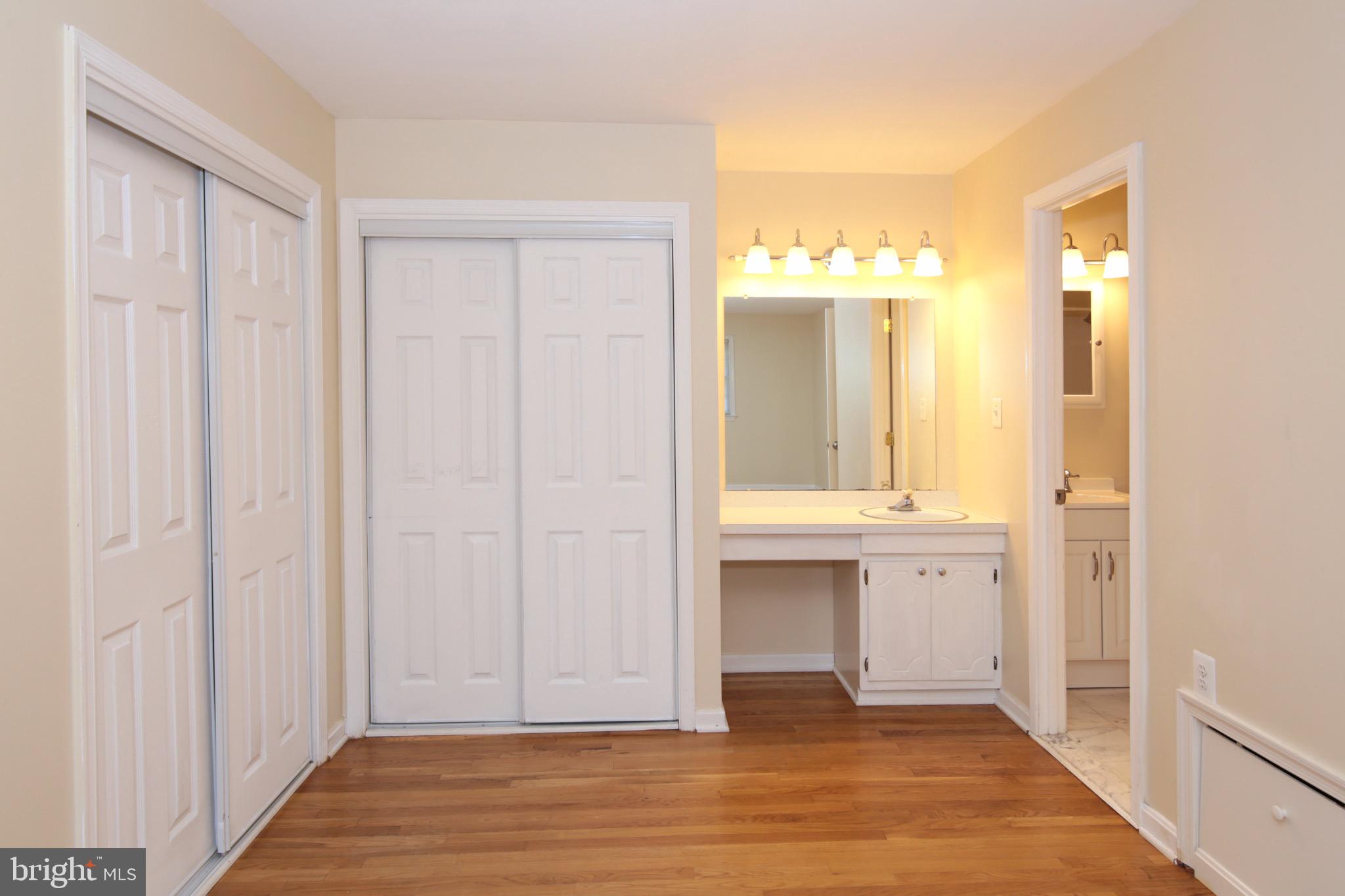 6623 Huntsman Boulevard Springfield, VA 22152 - Photo 20 of 32 Master Bedroom with 2 Closets and Dressing Area