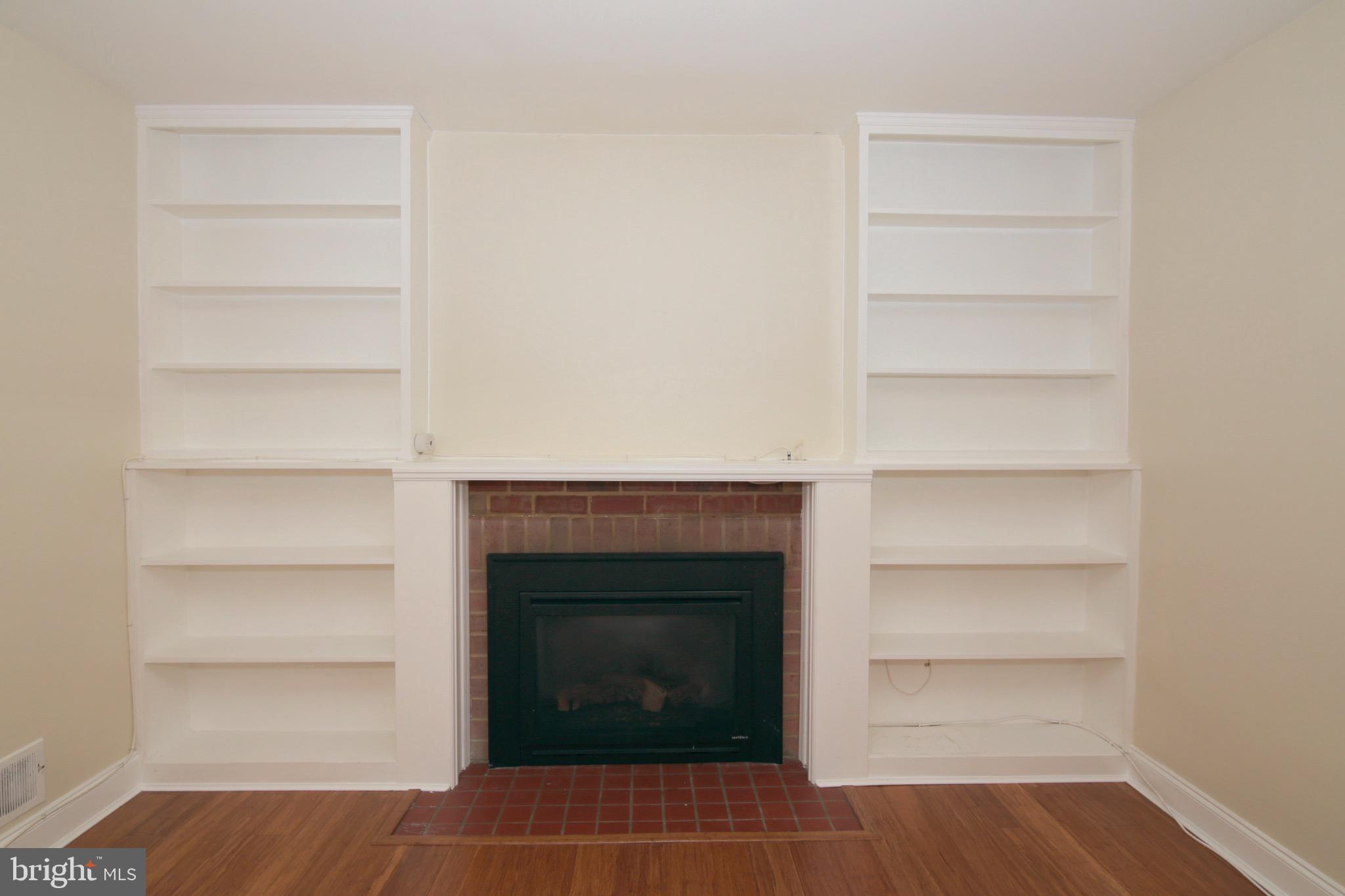 6623 Huntsman Boulevard Springfield, VA 22152 - Photo 8 of 32 Living Room with Built-in Bookcases