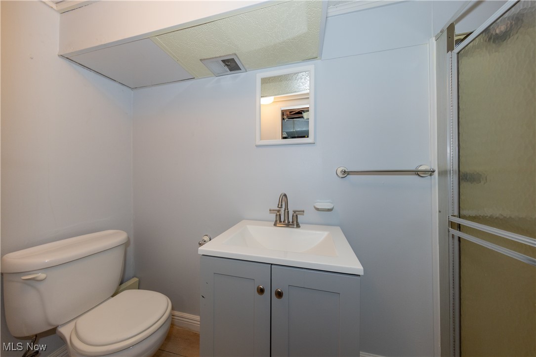 29103 Barjode Road Eastlake, OH 44095 - Photo 25 of 31 Full bath with a shower stall, vanity, and tile patterned floors