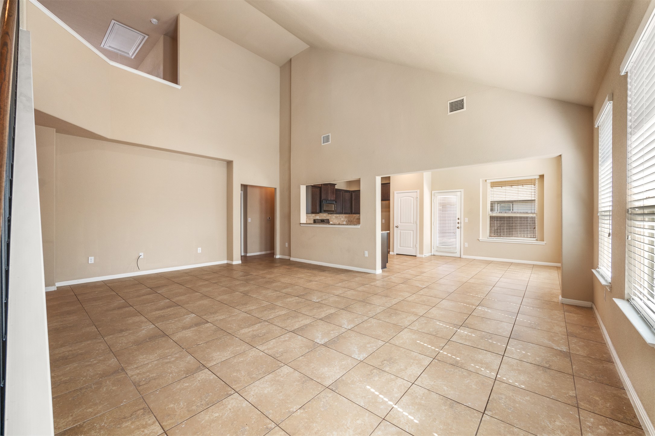 125 Serrano Street Georgetown, TX 78628 - Photo 3 of 18 a view of an empty room with a window