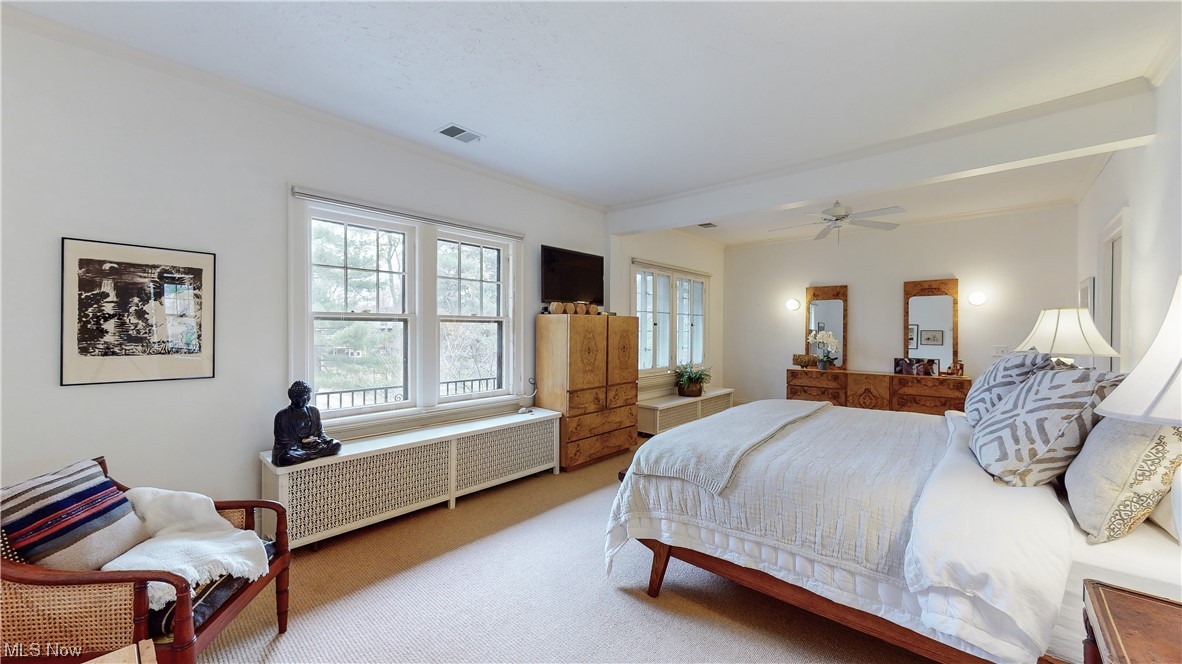 2854 East Overlook Road Cleveland, OH 44118 - Photo 16 of 35 Carpeted bedroom with ceiling fan and radiator heating unit