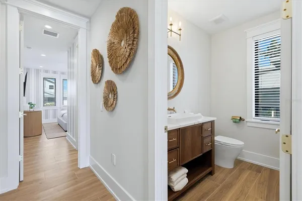 a balcony with furniture and wooden floor