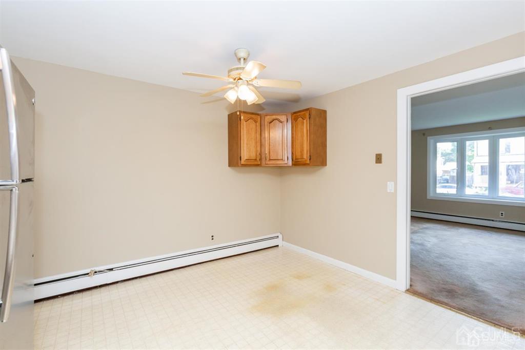 642 Front Street Dunellen, NJ 08812 - Photo 12 of 24 an empty room with windows and fan