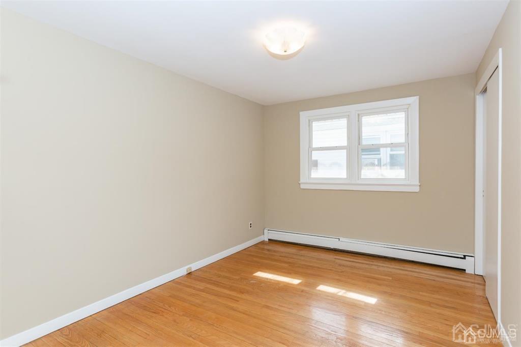 642 Front Street Dunellen, NJ 08812 - Photo 14 of 24 an empty room with a window