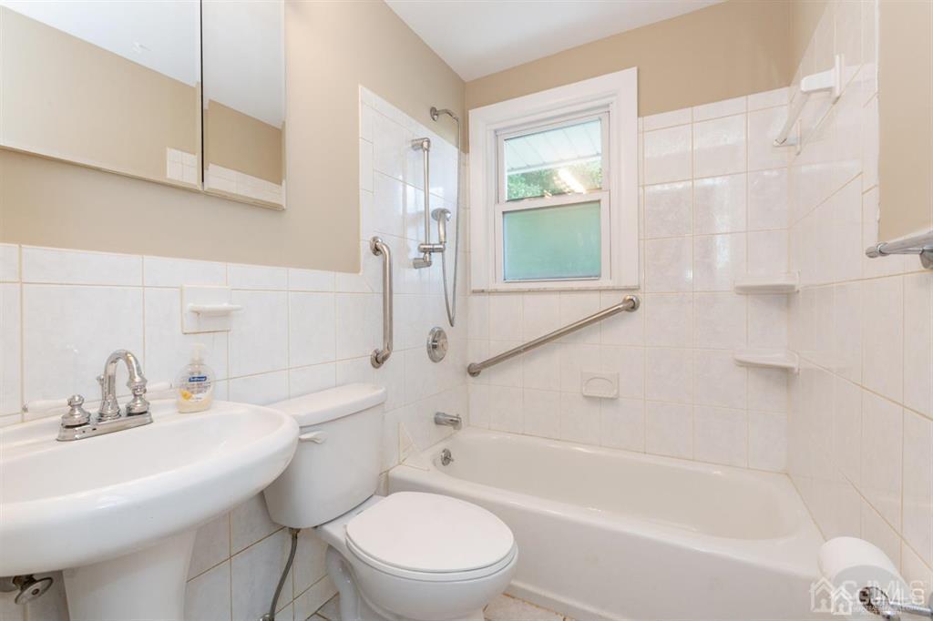 642 Front Street Dunellen, NJ 08812 - Photo 16 of 24 a bathroom with a sink toilet and shower