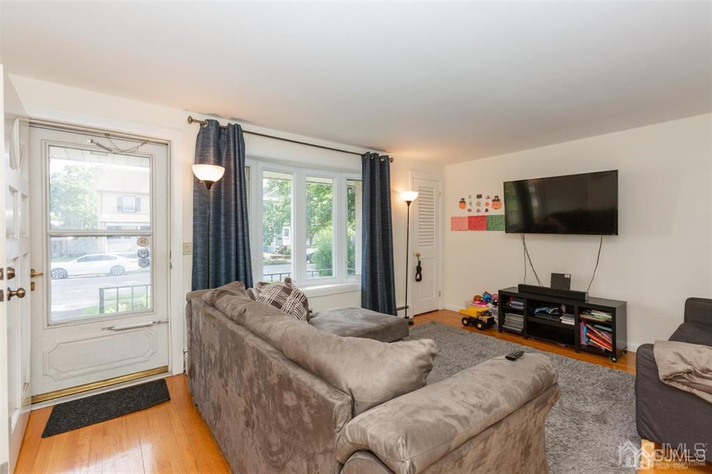 642 Front Street Dunellen, NJ 08812 - Photo 17 of 24 a living room with furniture and a flat screen tv
