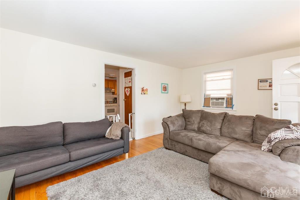 642 Front Street Dunellen, NJ 08812 - Photo 18 of 24 a living room with furniture and a couch