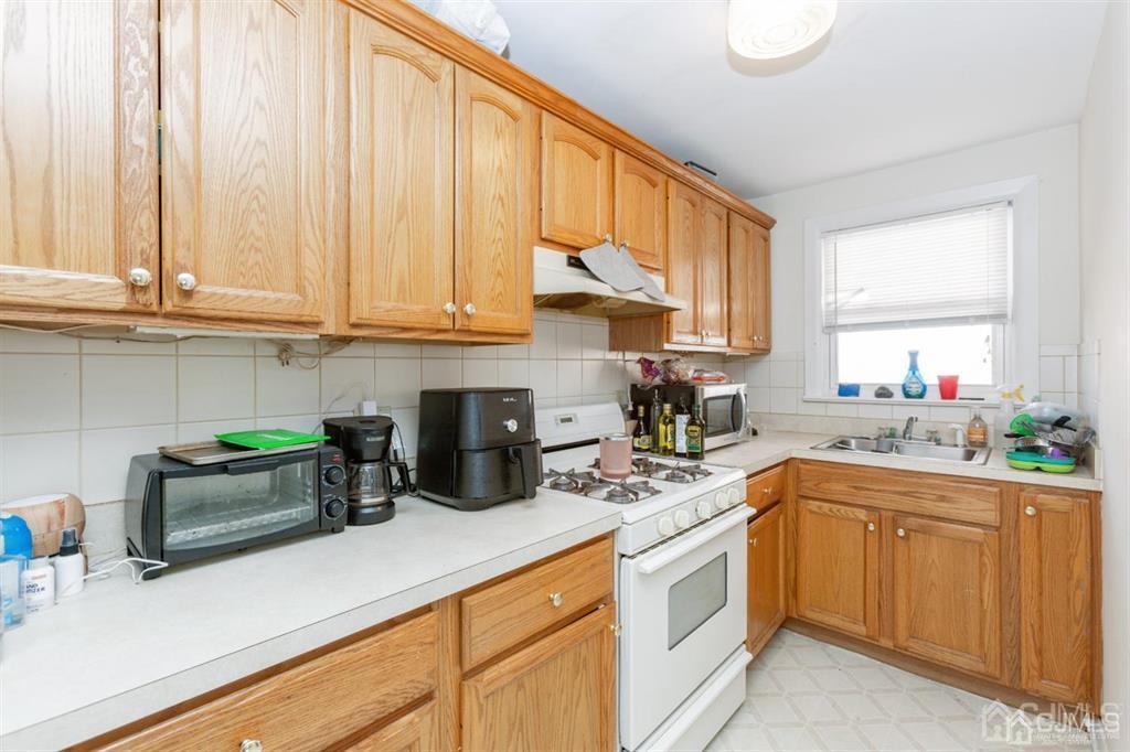 642 Front Street Dunellen, NJ 08812 - Photo 20 of 24 a kitchen with a sink and cabinets
