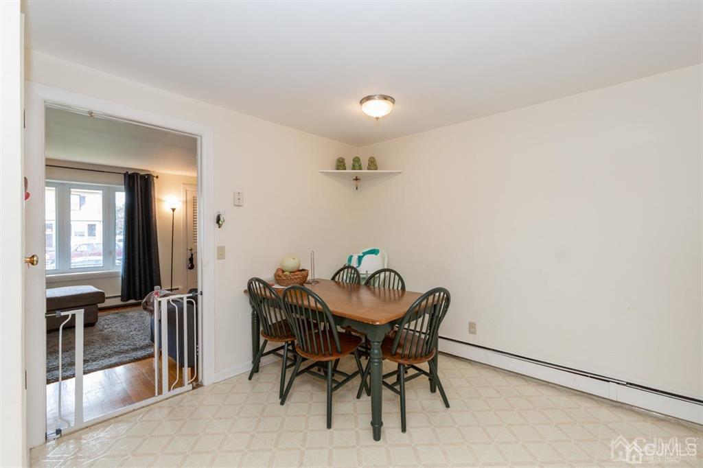 642 Front Street Dunellen, NJ 08812 - Photo 21 of 24 a view of a dining room with furniture and a chandelier
