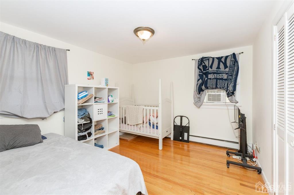 642 Front Street Dunellen, NJ 08812 - Photo 23 of 24 a bedroom with furniture and a window