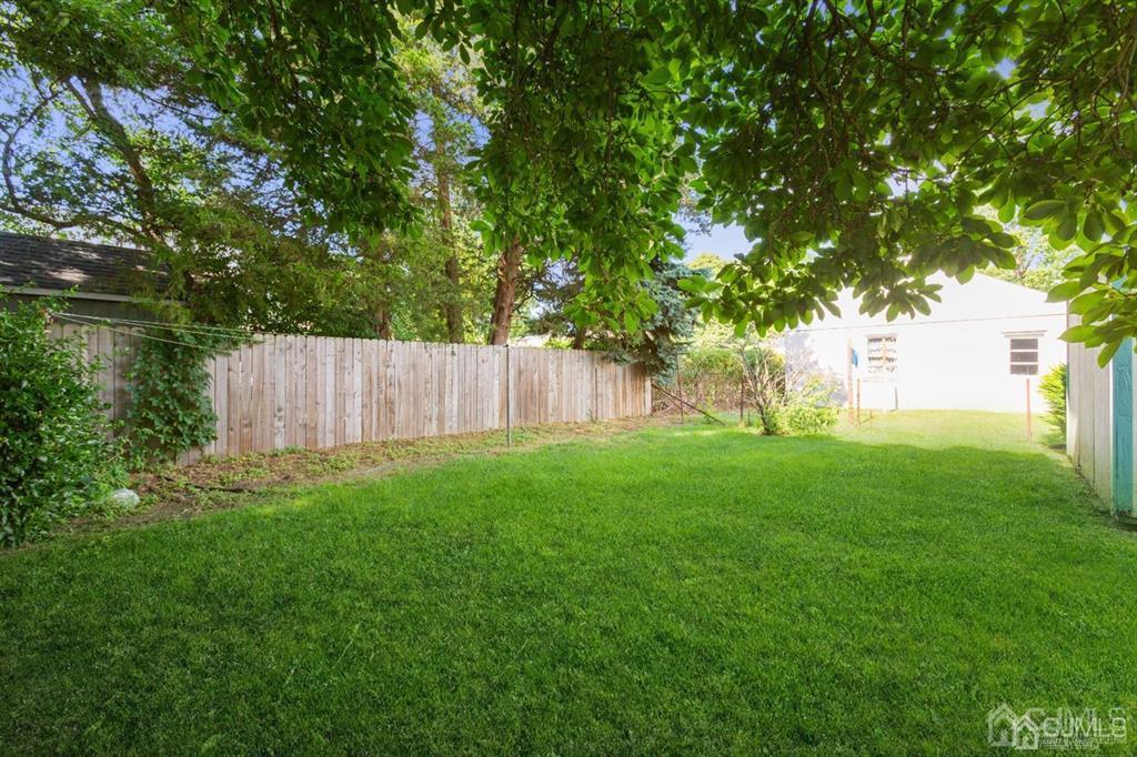642 Front Street Dunellen, NJ 08812 - Photo 7 of 24 a view of backyard with tree