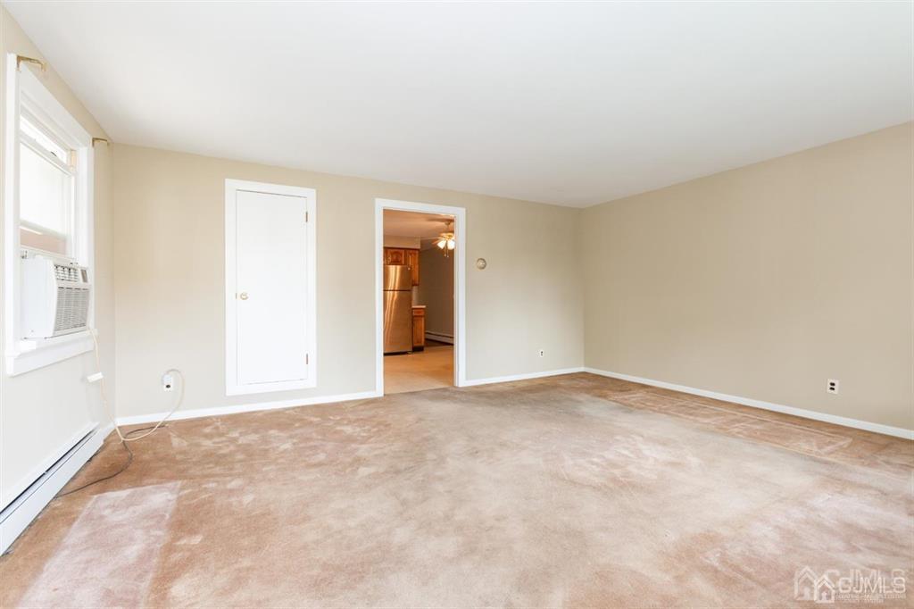 642 Front Street Dunellen, NJ 08812 - Photo 8 of 24 a view of an empty room with a window