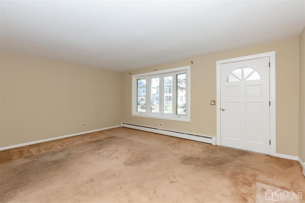 642 Front Street Dunellen, NJ 08812 - Photo 9 of 24 an empty room with windows