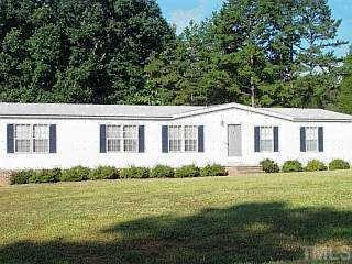 5743 Hobgood Road Rougemont, NC 27572 - Photo 1 of 1 a house view with a garden space