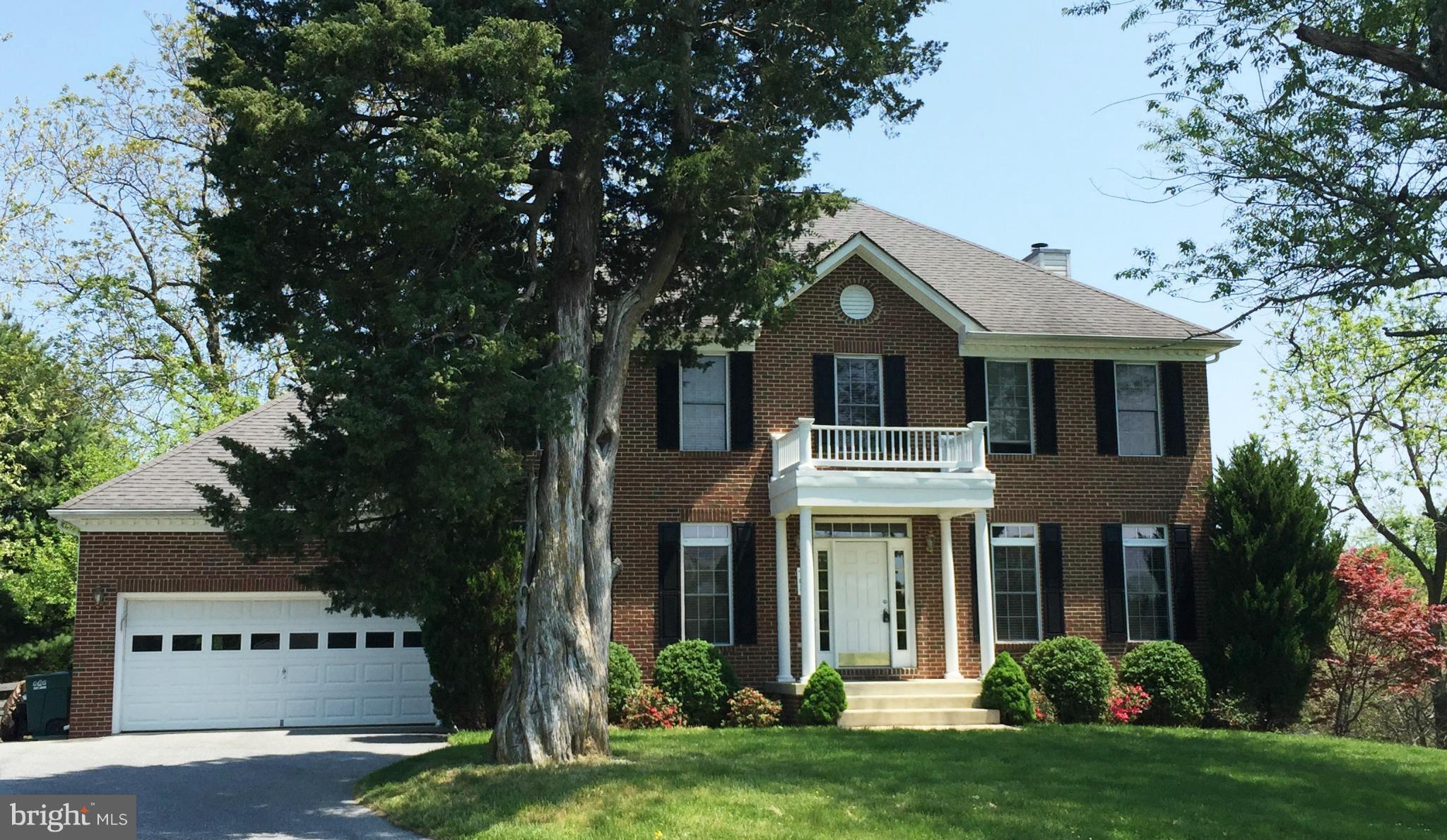 708 Hillmeade Road Edgewater, MD 21037 - Photo 1 of 23 a front view of a house with a garden
