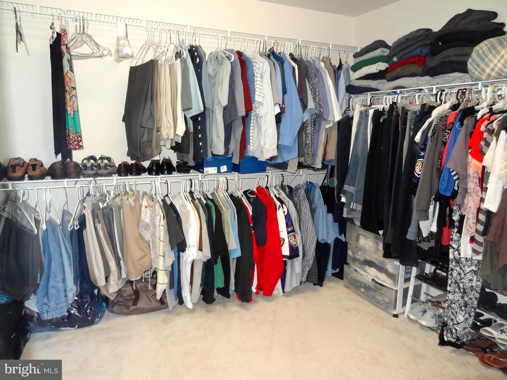 708 Hillmeade Road Edgewater, MD 21037 - Photo 14 of 23 a view of walk in closet with clothes