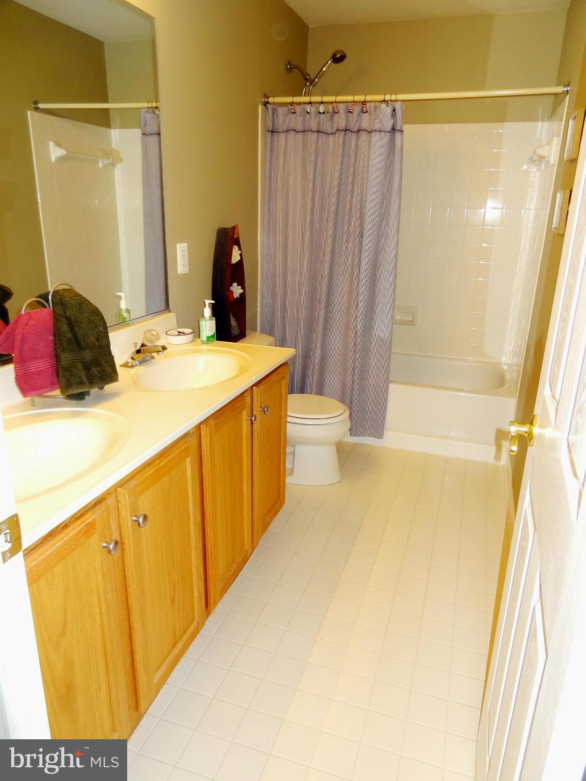708 Hillmeade Road Edgewater, MD 21037 - Photo 15 of 23 a bathroom with a sink and a mirror
