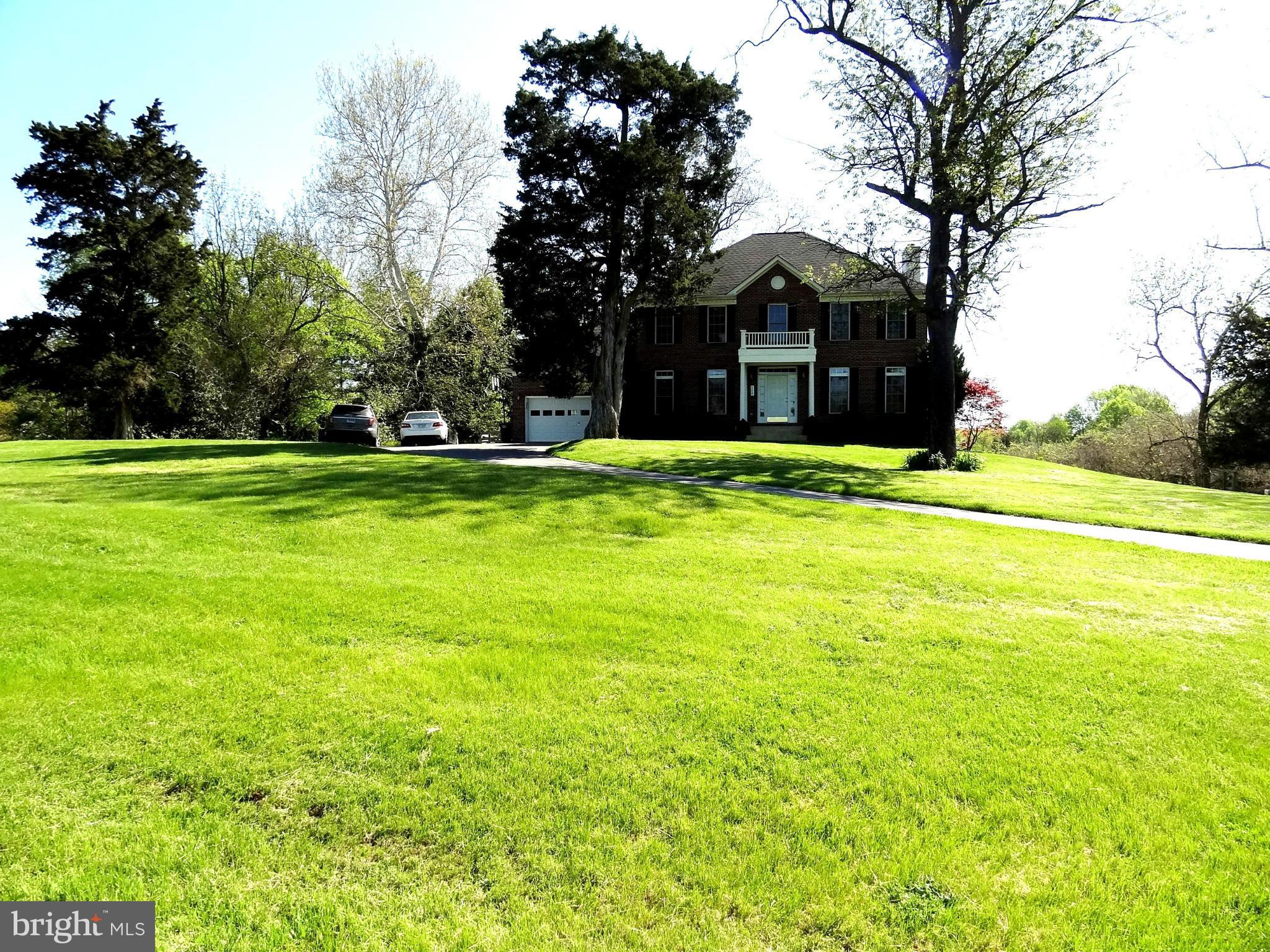 708 Hillmeade Road Edgewater, MD 21037 - Photo 21 of 23 a front view of a house with a yard