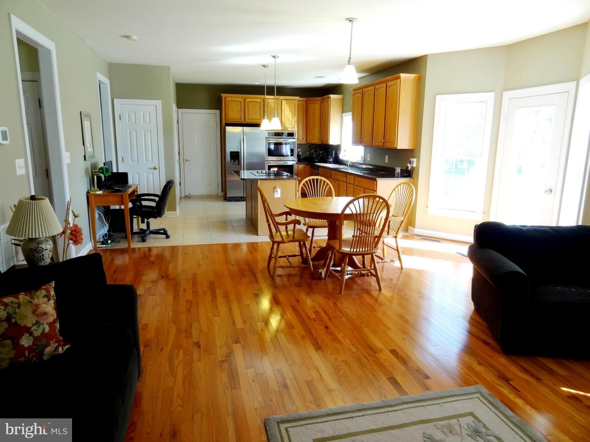 708 Hillmeade Road Edgewater, MD 21037 - Photo 5 of 23 a view of a dining room with furniture window and outside view