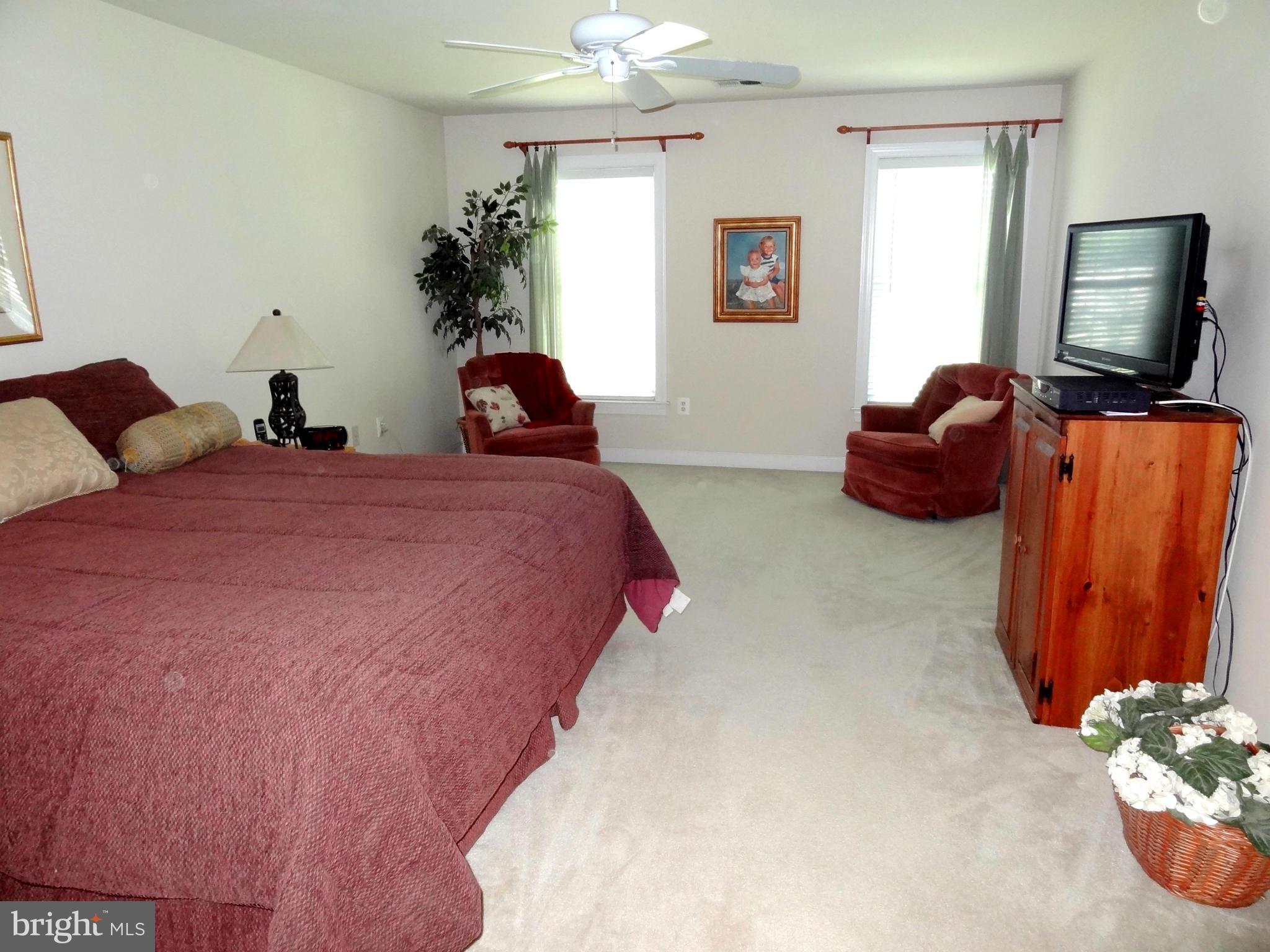 708 Hillmeade Road Edgewater, MD 21037 - Photo 9 of 23 a bedroom with bed window and flowerpot