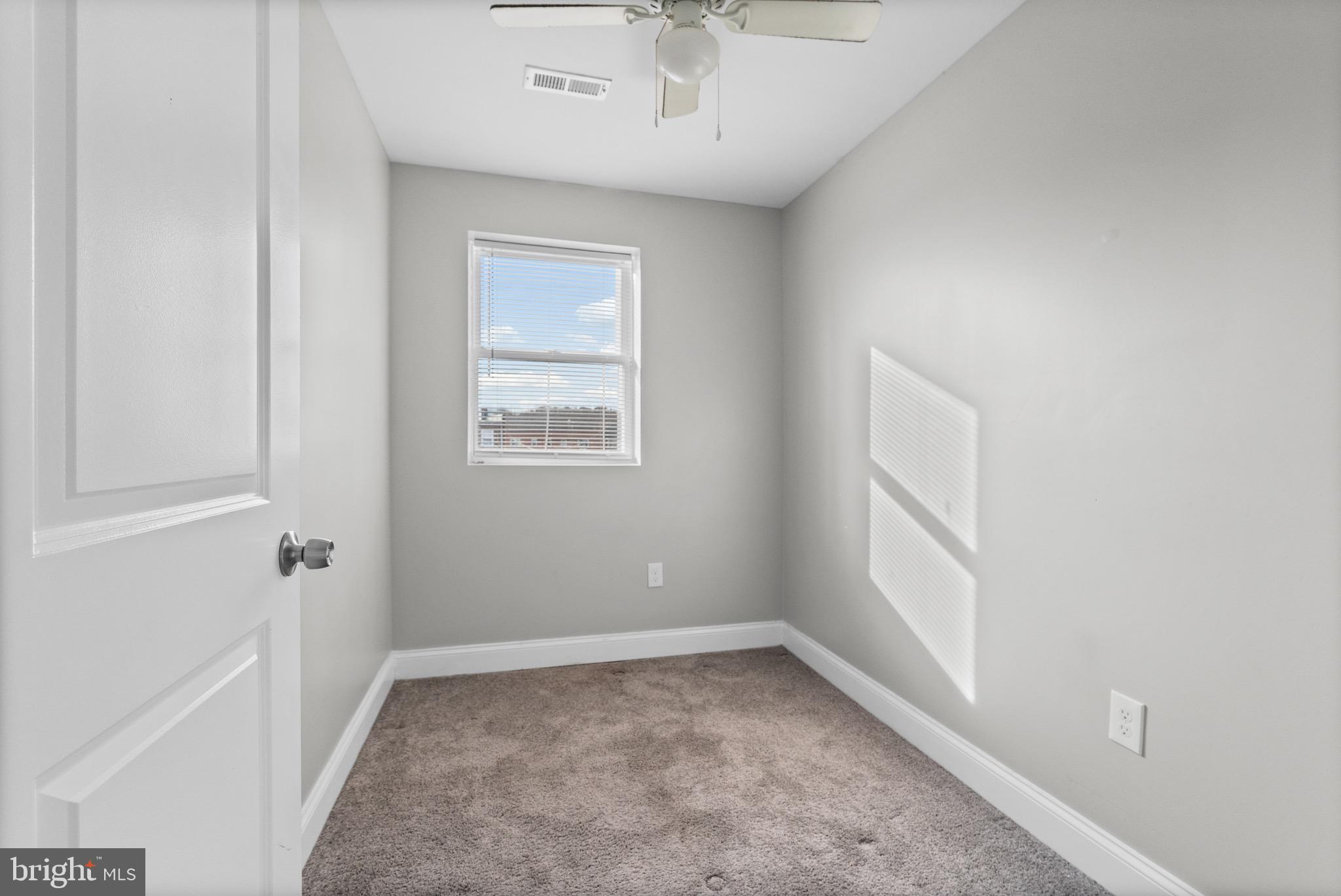 4139 Mountwood Road Baltimore, MD 21229 - Photo 12 of 53 an empty room with a window