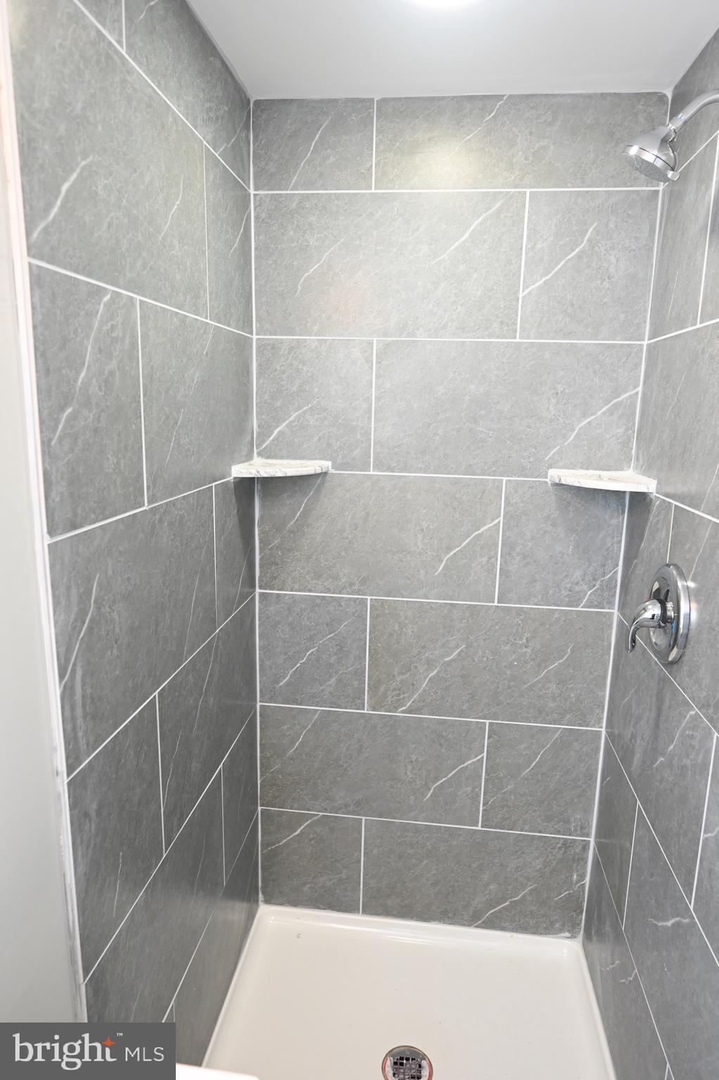 4139 Mountwood Road Baltimore, MD 21229 - Photo 22 of 53 a bathroom with a shower