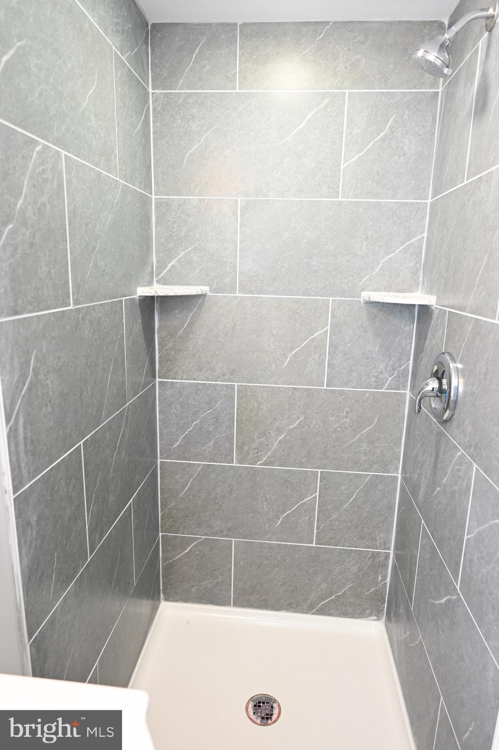4139 Mountwood Road Baltimore, MD 21229 - Photo 24 of 53 a bathroom with a shower
